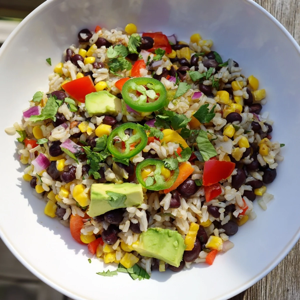 Steaming hot One-Pot Mexican Rice & Beans, garnished with fresh cilantro and ready to serve.