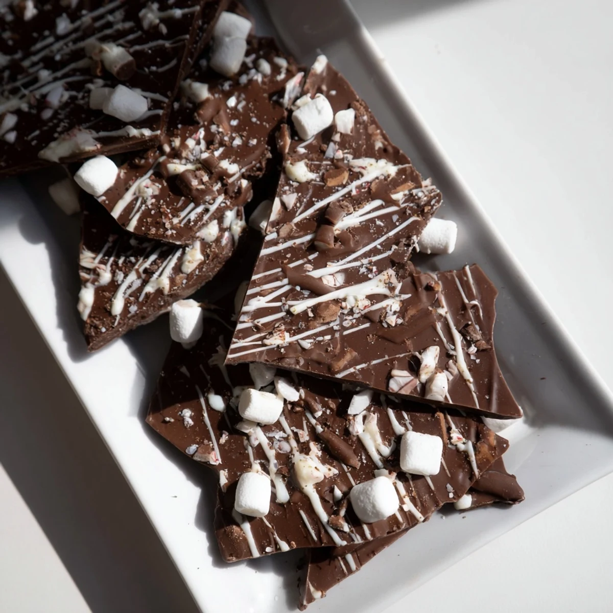 Melted semisweet chocolate transformed into Hot Chocolate Bomb Bark, a visually appealing holiday treat.