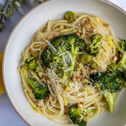 Golden roasted garlic lemon broccoli angel hair pasta, a bright and flavorful vegetarian meal.