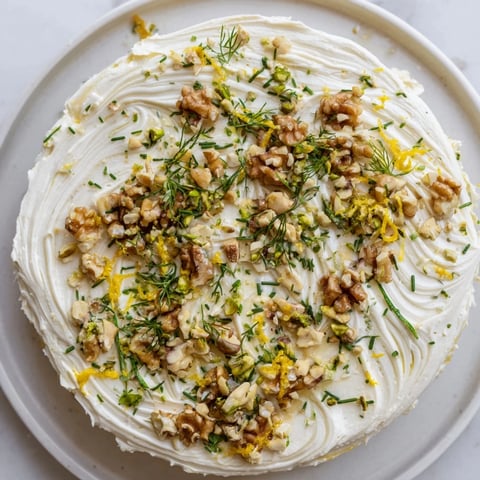 Creamy butter board charcuterie with toasted nuts, herbs, and lemon, ready to be enjoyed.