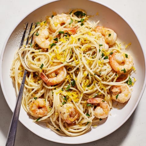 Creamy Lemon Garlic Shrimp Pasta recipe; imagine the aroma of savory garlic butter.
