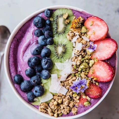 Delightful smoothie bowls featuring creamy pistachio and colorful berries for a healthy treat.  