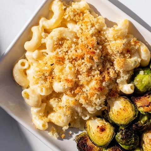A delicious, cheesy skillet of Sheet Pan Mac and Cheese, featuring golden brown, bubbly topping.