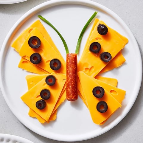 Savory salami body and cheese wings make the delicious The Butterfly Migration appetizer ready to serve.