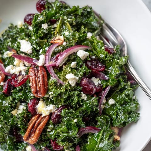 Vibrant massaged kale tossed with warm maple mustard dressing, topped with toasted pecans and dried cranberries.