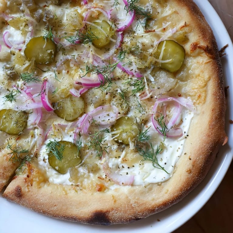 Savor the flavors of Pickle Pizza with melted cheese and zesty pickles baked.
