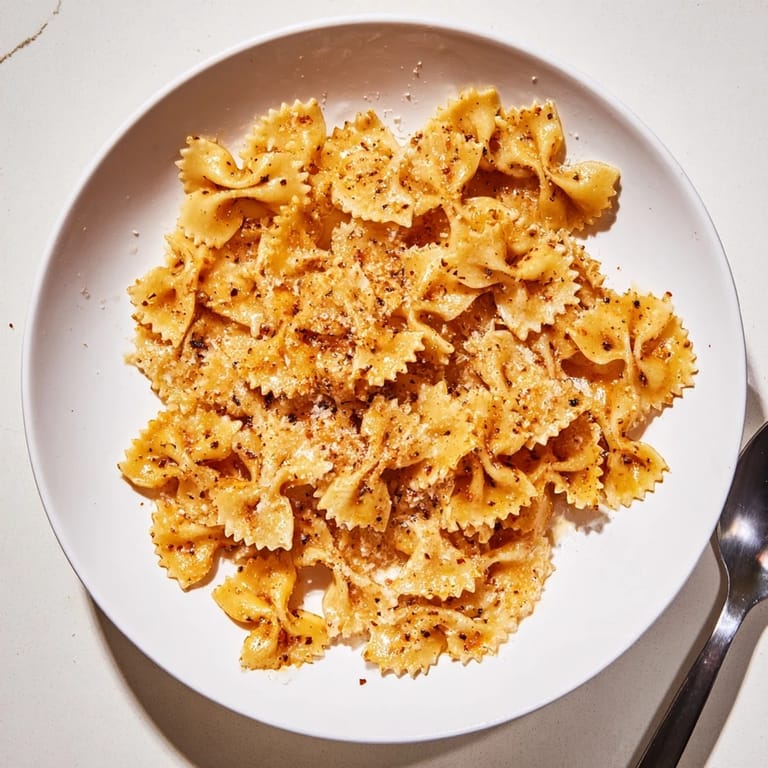 Golden baked pasta chips, lightly seasoned for an irresistible crunchy appetizer.  