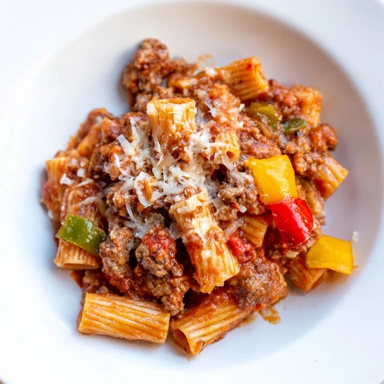 Cheesy Baked Rigatoni with Sausage & Peppers, a comforting Italian casserole with rich tomato sauce.