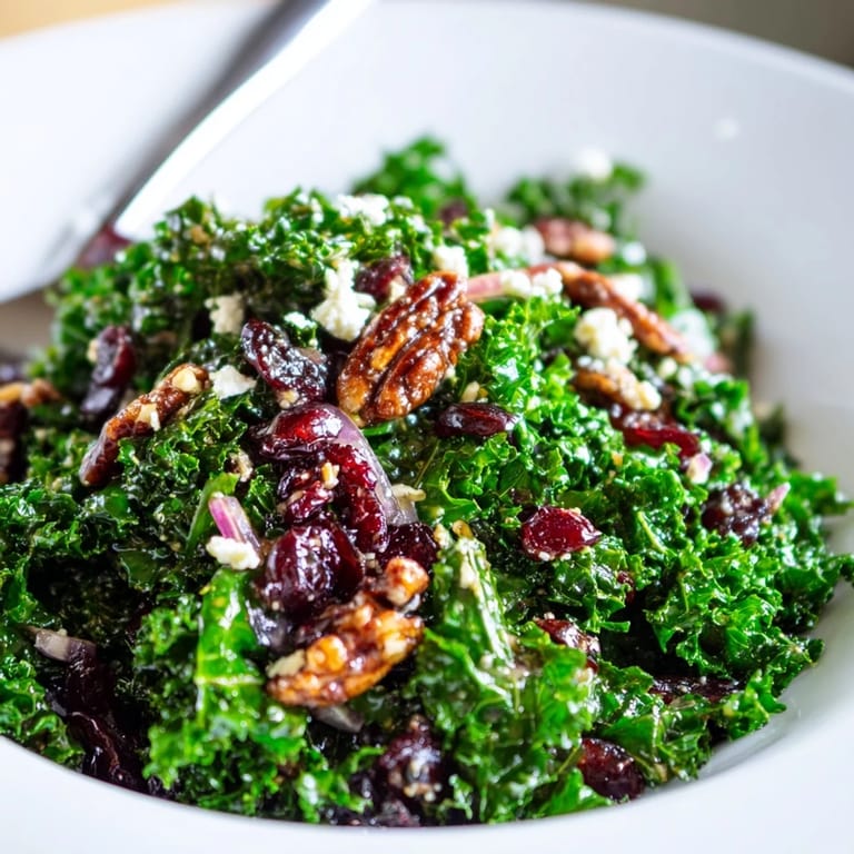 Hearty warm kale salad with sweet maple mustard glaze, red onion, and optional feta cheese.